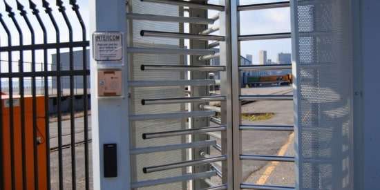 Access control system with full-height turnstile gate for secure facility entry management.