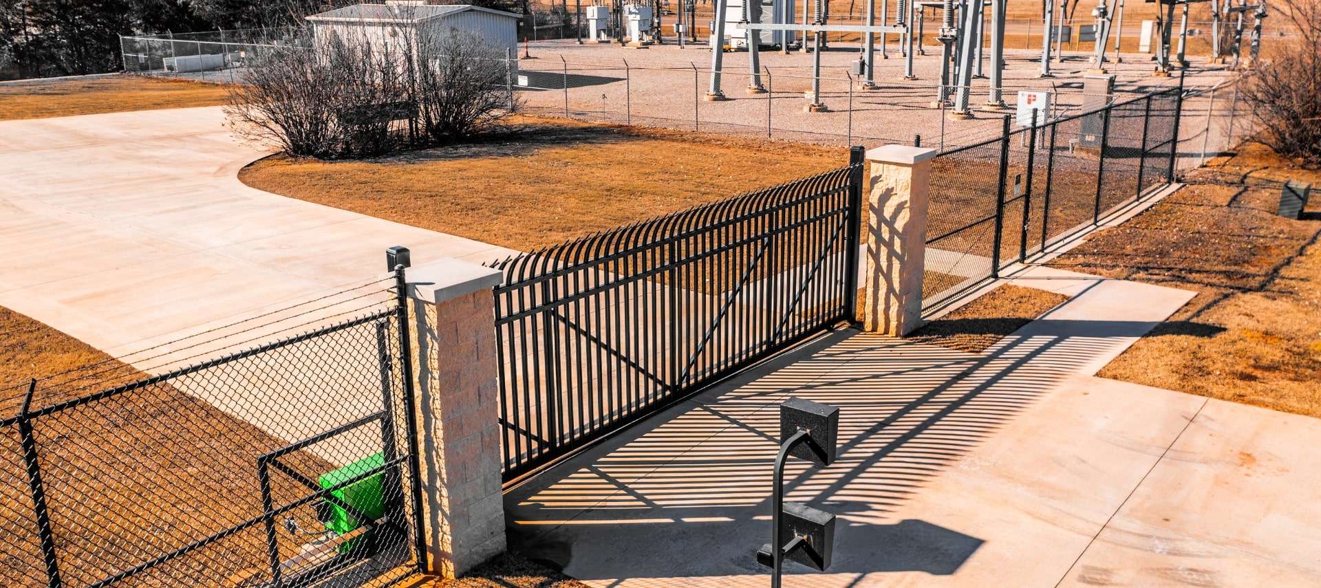 Secure perimeter fencing around high-voltage utility infrastructure.